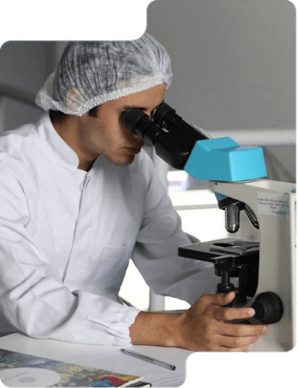 A microscope being used by a doctor in a hospital that has worked with ZCOM Labs to build a seamless patientflow UI system.