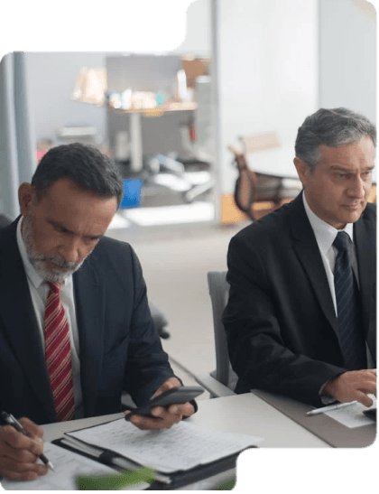 Two men working in a bank, in Toronto, that has worked with ZCOM Labs to craft an elegant user interface.